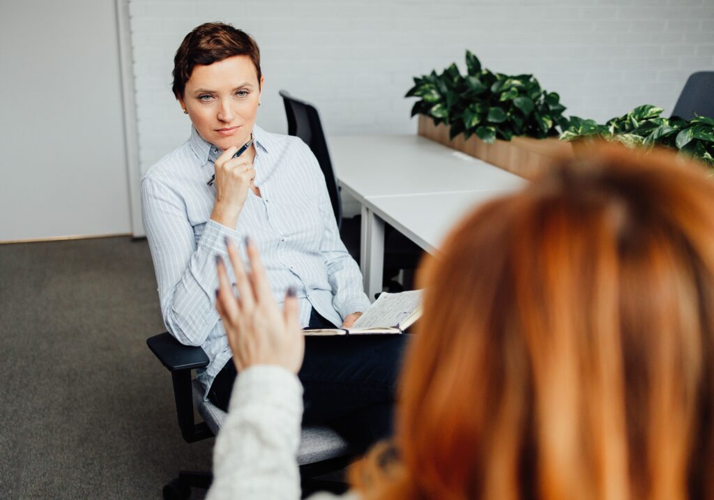 Two business women talking