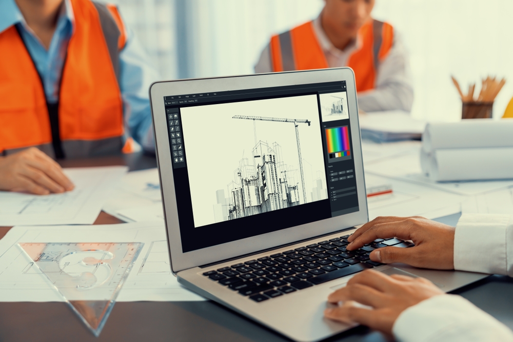 An architectural designer working on a laptop.