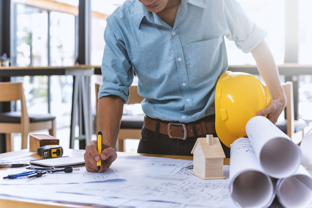 A civil engineer working in his office.